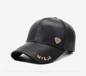 Detailed close-up of a black leather baseball cap with a vintage bronze shield emblem