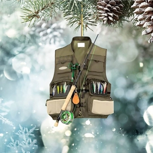 Detailed close-up of a fishing vest ornament hanging on a blurred Christmas tree branch