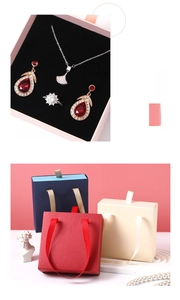 Detailed view of colorful drawer-style jewelry gift boxes with elegant ribbon pulls