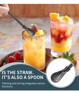 Detail of 304 stainless steel straw spoon filtering and stirring juice in a colorful glass