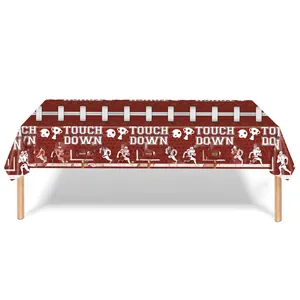 Detail of football party tablecloth featuring Touch Down print and helmet graphics
