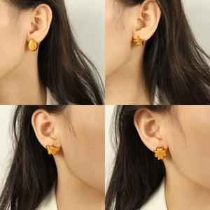 Elegant gold plated heart and star studs collection shown on model for a trendy look