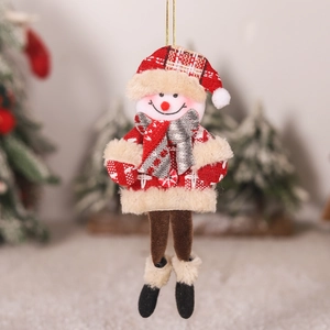 Close-up of plush Christmas snowman ornament with red and beige knitted details