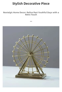 Close-up of a vintage golden ferris wheel model with a rectangular metal base