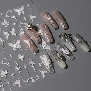 3D white butterfly nail art stickers with embossed stars and elegant rhinestone accents