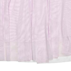 Close-up of pink pleated mesh fabric texture and white inner lining of the long dress