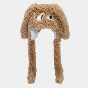 Detail of brown plush dog hat featuring large cartoon eyes and long warm earflaps