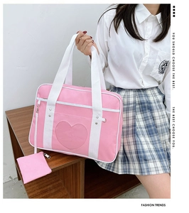 Pink JK uniform handbag featuring a heart-shaped transparent window and matching pouch