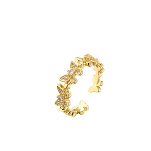 Adjustable gold butterfly ring featuring micro-pave cubic zirconia on white background