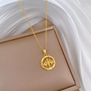 Luxurious gold stainless steel necklace with a crystal-encrusted bee pendant on silk