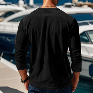 Close-up of men's black ribbed long sleeve T-shirt showing texture on a model's back