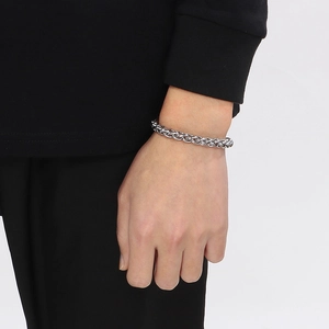 Detailed shot of stainless steel OT buckle bracelet with polished basket weave chain link