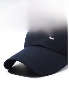 Detail of CREATIVE embroidery on navy blue cotton twill baseball cap with curved brim