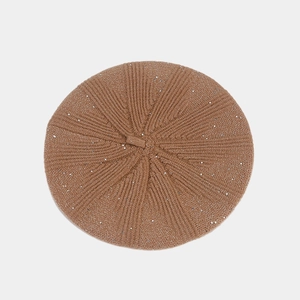 Detail of khaki sequined knit beret showing textured ribbed wool and silver sparkles