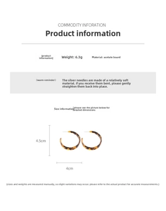 Detail view of acetate leopard print C-shape earrings showing 4.5cm by 4cm dimensions