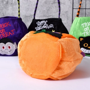 Group display of Halloween plush candy baskets with pumpkin, cat and vampire designs