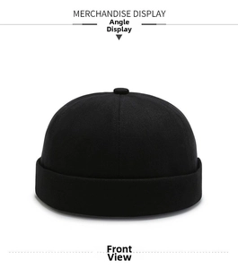Detailed front view of a black cotton docker hat with six-panel stitching and folded brim