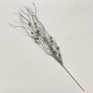 Close-up of a silver glittered branch stem with wavy filaments for Christmas tree decoration