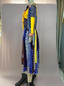 Detail showing mixed geometric patterns and bohemian print on a midi length dress fabric