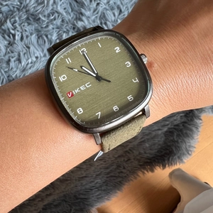 Minimalist square green dial watch with suede leather strap and Arabic numerals