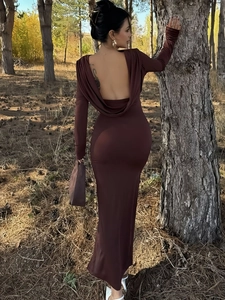 Macro shot of the deep V backless design with elegant draping on this brown bodycon dress