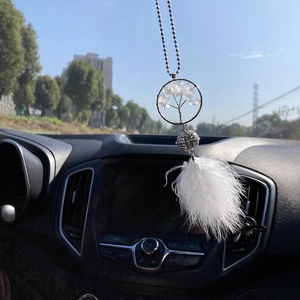 Silver tree of life car charm with white crystals and feathers on rearview mirror