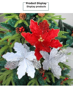Close-up of glitter hollow Christmas flowers with metallic beads on a decorated tree branch