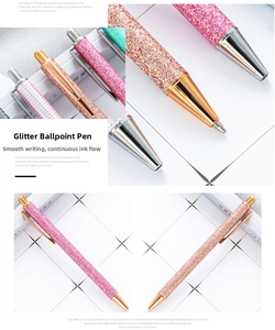 Detailed view of pink and champagne gold glitter retractable ballpoint pens with metal clip