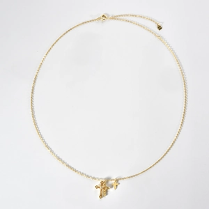 Detailed macro view of S925 sterling silver gold layered double cross pendant necklaces
