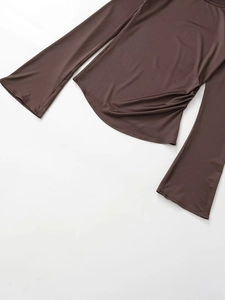 Flat lay of brown long sleeve shirt with side ruching and flared cuffs on white background