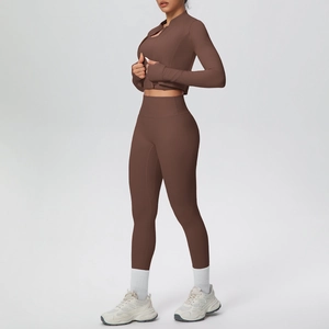 Three-piece yoga set featuring a brown zip-up jacket, sports bra, and high-waist leggings