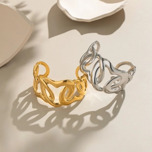Polished chunky chain link cuff bracelets in gold and silver finish with architectural shadows