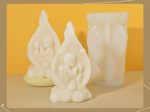 Macro detail of silicone candle mold with 3D praying angel and feather wing designs