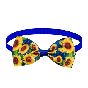 Close-up of sunflower pattern on dark blue ribbed fabric pet bowtie accessory
