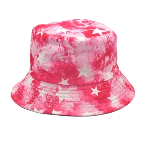 Detail of pink and white tie-dye bucket hat featuring printed white stars on thick canvas