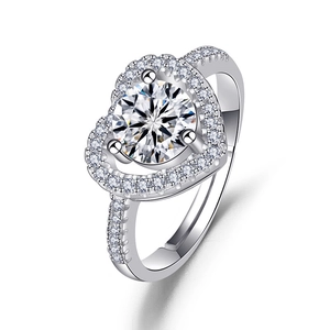 Macro shot of heart-shaped halo ring featuring an adjustable band and cubic zirconia