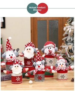 Close-up of Santa and Snowman plush Christmas gift buckets with soft felt and handles