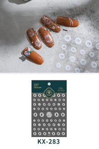 Detail of KX-283 nail stickers with cute bear and snowflake designs on brown nails
