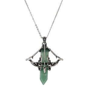 Detailed close-up of Cupid's arrow pendant with green crystal on a silver chain