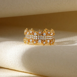 Macro shot of 18K gold plated ring featuring intricate floral zircon pave settings