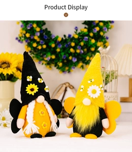 Close-up of plush bee gnomes with sunflowers and wings for spring home decor