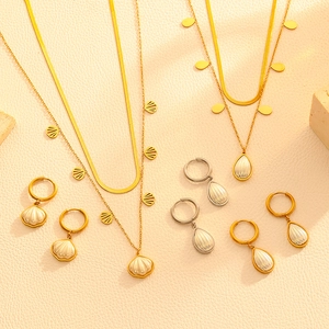 Dual-layer stainless steel shell and drop pearl jewelry set in gold and silver finish
