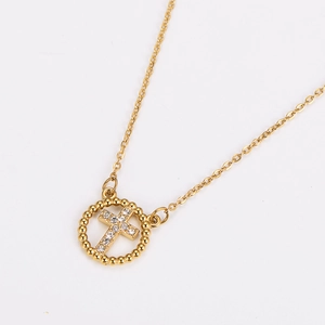 Detailed view of a gold-plated circular hollow cross necklace with sparkling zircons