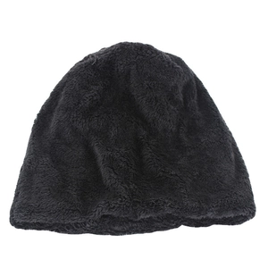 Close-up detail of the dark grey plush faux fur lining inside the winter knit beanie