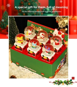 Detail view of 6-piece Christmas crystal ball set with cartoon figures and display box
