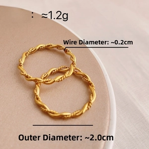 Detail of two golden twisted rope rings showing weight 1.2g and 0.2cm wire diameter