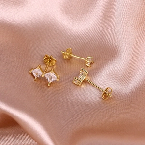 Close-up of S925 sterling silver stamp on gold plated square zircon stud earrings