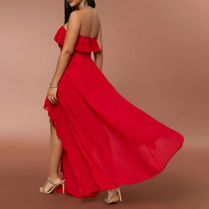 Detail of red strapless high-low dress with layered ruffles and flowing chiffon hem