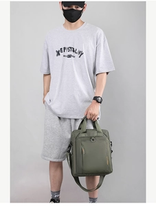 Army green nylon shoulder bag shown as a complete business casual outfit for men