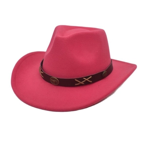 Detail of magenta felt cowboy hat featuring leather band and metal bull head stud